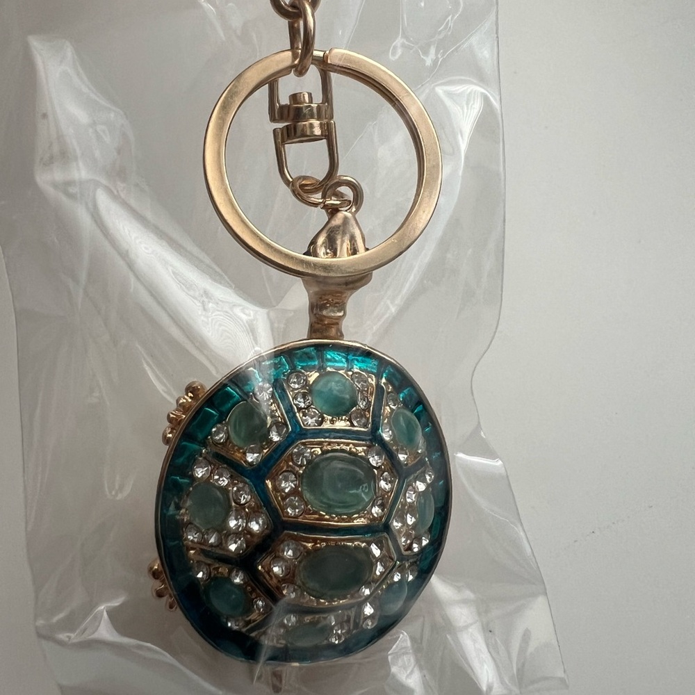 Elegant Gold and Green Keychain with Gem Accents